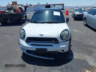 2015 MINI Countryman S with VIN WMWZC3C58FWT05613, listed as a IAAI auction lot 42374870 with 124,214 mi miles and . Bid and sale history available at DreamBid. Image 6.