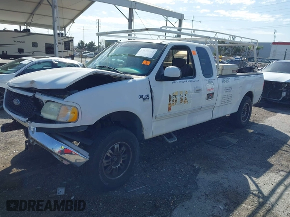 2002 Ford F-150 XL with VIN 1FTRX17L82NA54581, listed as a IAAI auction lot 41698662 with 220,321 mi miles. Bid and sale history available at carsss.com. Image 17.