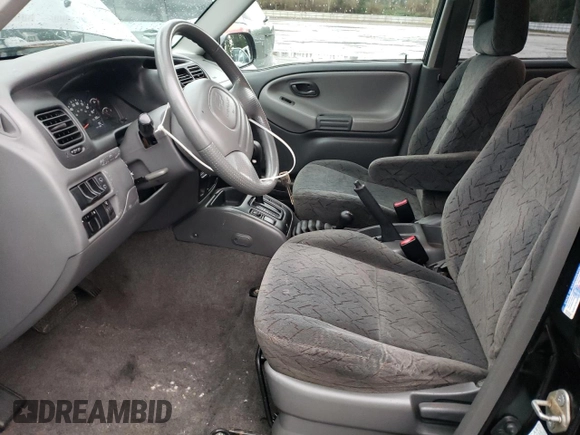 2003 Chevrolet Tracker ZR2 z VIN 2CNBJ734736946410, wystawiony jako Copart lot #82210474 z przebiegiem 61 414 mil mil oraz Szkoda całkowita • Salvage title. Historia ofert i sprzedaży dostępna na DreamBid. Obrazek 7.