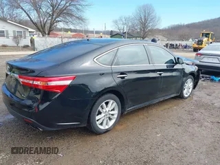 2014 Toyota Avalon Limited with VIN 4T1BK1EB2EU103936, listed as a IAAI auction lot 41703894 with 104,657 mi miles. Bid and sale history available at carsss.com. Image 4.