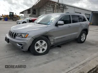 2017 Jeep Grand Cherokee Laredo with VIN 1C4RJEAG0HC664063, listed as a Copart auction lot 54850295 with 82,913 mi miles and Salvage title. Bid and sale history available at DreamBid. Image 1.