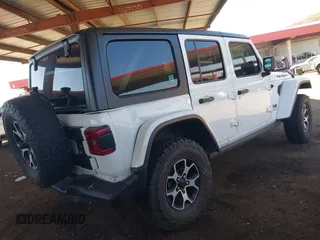2020 Jeep Wrangler Unlimited Rubicon with VIN 1C4HJXFGXLW107958, listed as a IAAI auction lot 42058477 with 69,951 mi miles and . Bid and sale history available at DreamBid. Image 4.