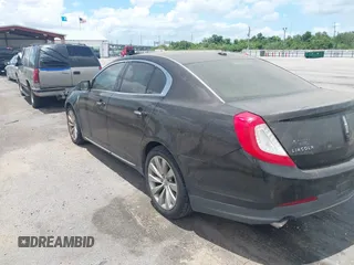 2014 Lincoln MKS with VIN 1LNHL9DK0EG605429, listed as a IAAI auction lot 42809745 with 127,038 mi miles and . Bid and sale history available at DreamBid. Image 3.