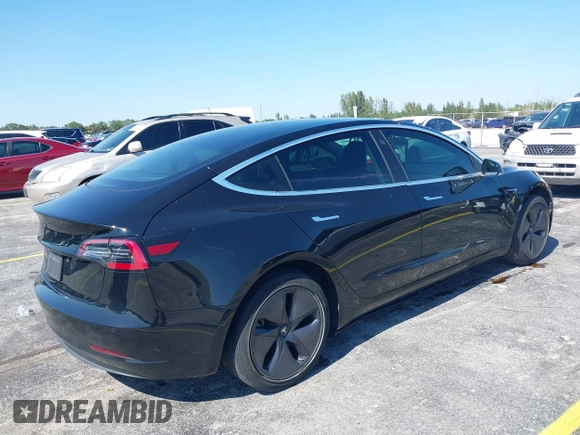 2019 Tesla Model 3 Mid Range with VIN 5YJ3E1EA0KF317058, listed as a IAAI auction lot 42025195 with 108,771 mi miles. Bid and sale history available at carsss.com. Image 4.