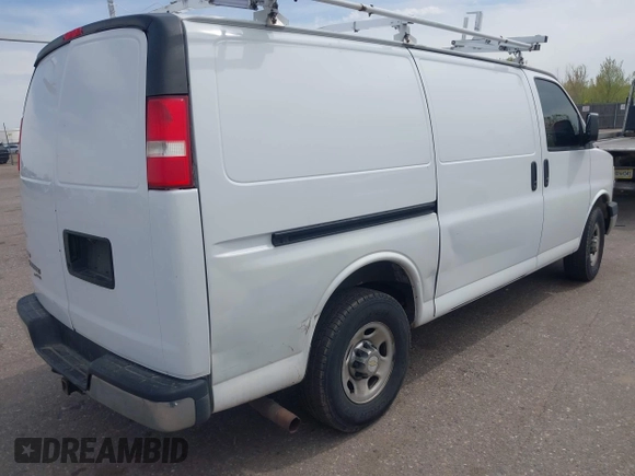2012 Chevrolet Express Cargo Van with VIN 1GCWGFCA7C1121989, listed as a IAAI auction lot 42118853 with 214,478 mi miles. Bid and sale history available at carsss.com. Image 4.