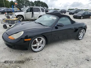 2000 Porsche Boxster z VIN WP0CA298XYU624357, wystawiony jako Copart lot #59639435 z przebiegiem 112 773 mil mil oraz Czysty tytuł • Clean title. Historia ofert i sprzedaży dostępna na DreamBid. Obrazek 1.