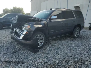 2017 Chevrolet Tahoe Premier with VIN 1GNSCCKC5HR227109, listed as a Copart auction lot 60874855 with 132,550 mi miles and Salvage title. Bid and sale history available at DreamBid. Image 1.