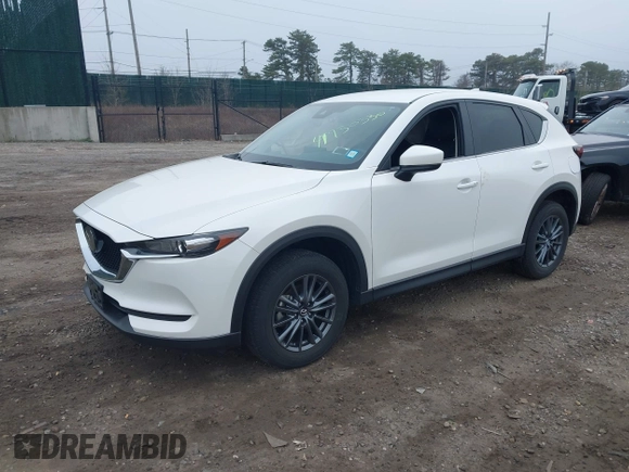 2021 Mazda CX-5 Touring with VIN JM3KFBCM1M1446313, listed as a IAAI auction lot 41930330 with 28,610 mi miles. Bid and sale history available at carsss.com. Image 18.
