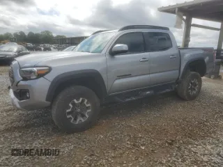 2021 Toyota Tacoma SR with VIN 3TMCZ5AN2MM374106, listed as a Copart auction lot 56593185 with 83,529 mi miles and Salvage title. Bid and sale history available at DreamBid. Image 1.