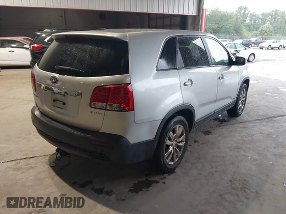 2011 Kia Sorento EX with VIN 5XYKUDA21BG024857, listed as a IAAI auction lot 42243340 with 145,514 mi miles and . Bid and sale history available at DreamBid. Image 4.