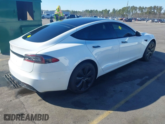2021 Tesla Model S Long Range with VIN 5YJSA1E56MF453711, listed as a IAAI auction lot 41467603 with 115,634 mi miles and . Bid and sale history available at DreamBid. Image 4.