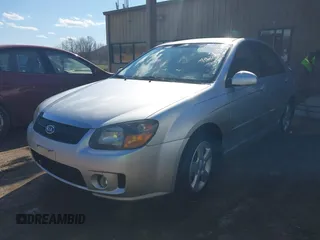 2009 Kia Spectra EX with VIN KNAFE221295026738, listed as a IAAI auction lot 41871548 with 238,130 mi miles. Bid and sale history available at carsss.com. Image 2.