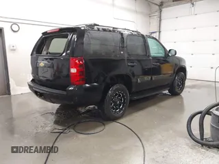 2013 Chevrolet Tahoe LT with VIN 1GNSKBE07DR305706, listed as a IAAI auction lot 42004594 with 166,020 mi miles and . Bid and sale history available at DreamBid. Image 4.