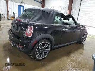 2013 MINI Convertible S with VIN WMWZP3C51DT297891, listed as a Copart auction lot 56745065 with 101,292 mi miles and Salvage title. Bid and sale history available at DreamBid. Image 3.