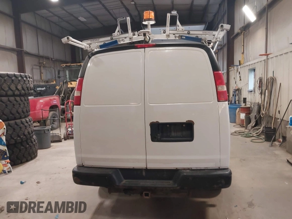 2015 Chevrolet Express Cargo Van with VIN 1GCWGFCF9F1167677, listed as a IAAI auction lot 42018087 with 148,263 mi miles. Bid and sale history available at carsss.com. Image 16.