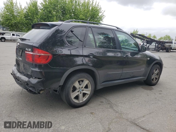 2012 BMW X5 35d with VIN 5UXZW0C54CL671377, listed as a Copart auction lot 60936395 with 105,903 mi miles and Salvage title. Bid and sale history available at DreamBid. Image 3.