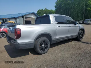 2018 Honda Ridgeline RTL-E with VIN 5FPYK3F77JB014975, listed as a Copart auction lot 59798125 with 124,361 mi miles and Clean title. Bid and sale history available at DreamBid. Image 3.