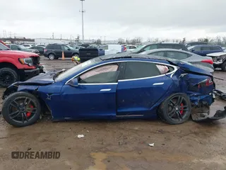 2016 Tesla Model S 90D with VIN 5YJSA1E44GF169960, listed as a IAAI auction lot 41523807 with 124,738 mi miles and . Bid and sale history available at DreamBid. Image 14.