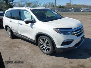 2017 Honda Pilot Touring z VIN 5FNYF6H93HB048032, wystawiony jako IAAI lot #41979902 z przebiegiem 133 461 mil mil oraz . Historia ofert i sprzedaży dostępna na DreamBid. Obrazek 1.
