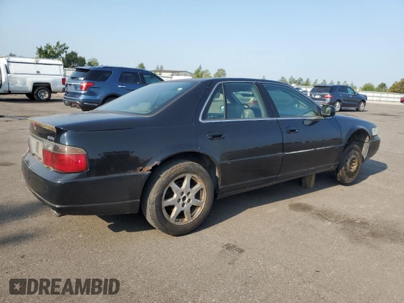 2002 Cadillac Seville Touring STS z VIN 1G6KY54922U210928, wystawiony jako Copart lot #71214564 z przebiegiem Nie podano mil oraz Czysty tytuł • Clean title. Historia ofert i sprzedaży dostępna na DreamBid. Obrazek 3.