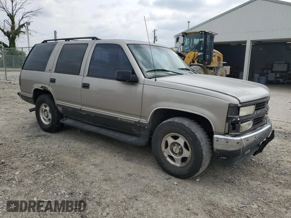 1999 Chevrolet Tahoe Z71 with VIN 1GNEK13R6XJ301562, listed as a Copart auction lot 59684595 with 200,561 mi miles and Salvage title. Bid and sale history available at DreamBid. Image 4.