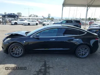 2019 Tesla Model 3 Mid Range with VIN 5YJ3E1EA1KF410297, listed as a IAAI auction lot 41841991 with 176,254 mi miles. Bid and sale history available at carsss.com. Image 14.