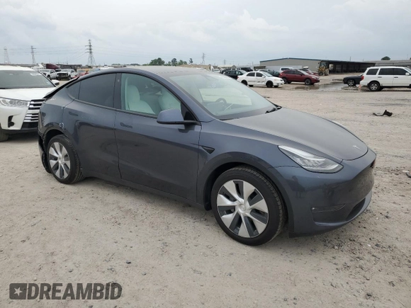 2022 Tesla Model Y Long Range with VIN 7SAYGDEE1NF315198, listed as a Copart auction lot 50399005 with 33,357 mi miles and Salvage Title. Bid and sale history available at DreamBid. Image 4.