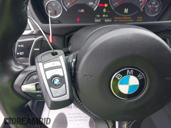 2019 BMW M4 with VIN WBS4Y9C53KAH82910, listed as a IAAI auction lot 41570315 with 59,227 mi miles. Bid and sale history available at carsss.com. Image 12.