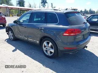 2012 Volkswagen Touareg Sport with VIN WVGFK9BP0CD004951, listed as a IAAI auction lot 42724125 with 173,993 mi miles and . Bid and sale history available at DreamBid. Image 3.