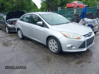2012 Ford Focus SE z VIN 1FAHP3F29CL404674, wystawiony jako IAAI lot #42341016 z przebiegiem 169 466 mil mil oraz . Historia ofert i sprzedaży dostępna na DreamBid. Obrazek 1.