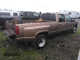 1996 GMC Sierra 1500 with VIN 1GTHC33J4TF010466, listed as a Copart auction lot 48392195 with 143,267 mi miles and Salvage Title. Bid and sale history available at DreamBid. Image 3.