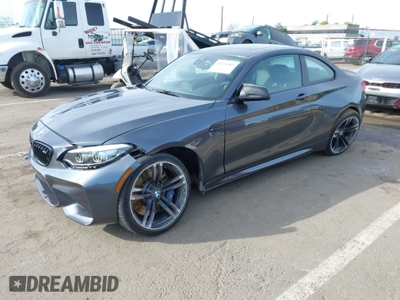 2018 BMW M2 with VIN WBS1J5C50JVE51869, listed as a IAAI auction lot 41814404 with 69,684 mi miles. Bid and sale history available at carsss.com. Image 2.