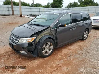 2012 Honda Odyssey Touring with VIN 5FNRL5H98CB115806, listed as a Copart auction lot 58422635 with 196,867 mi miles and Salvage title. Bid and sale history available at DreamBid. Image 1.