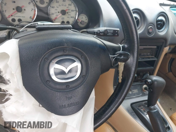 2002 Mazda MX-5 Miata Cloth with VIN JM1NB353520221312, listed as a IAAI auction lot 42410028 with 99,375 mi miles and . Bid and sale history available at DreamBid. Image 11.
