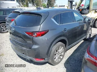 2020 Mazda CX-5 Grand Touring with VIN JM3KFADM7L0766278, listed as a IAAI auction lot 41297902 with 1 mi miles. Bid and sale history available at carsss.com. Image 4.