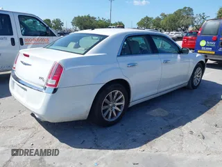 2014 Chrysler 300 with VIN 2C3CCAET6EH173381, listed as a IAAI auction lot 42158270 with 124,551 mi miles. Bid and sale history available at carsss.com. Image 4.