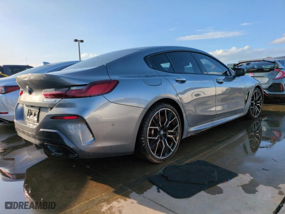 2023 BMW 8 Series M850i with VIN WBAGV8C02PCL20503, listed as a Copart auction lot 74098614 with 0 mi miles and Salvage Title. Bid and sale history available at carsss.com. Image 3.