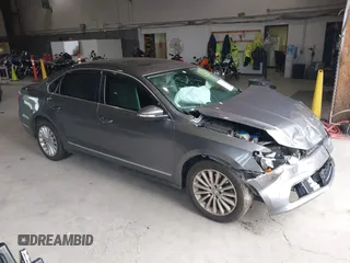 2016 Volkswagen Passat 1.8T SE with VIN 1VWBT7A35GC011129, listed as a IAAI auction lot 39977788 with 123,007 mi miles. Bid and sale history available at carsss.com. Image 1.