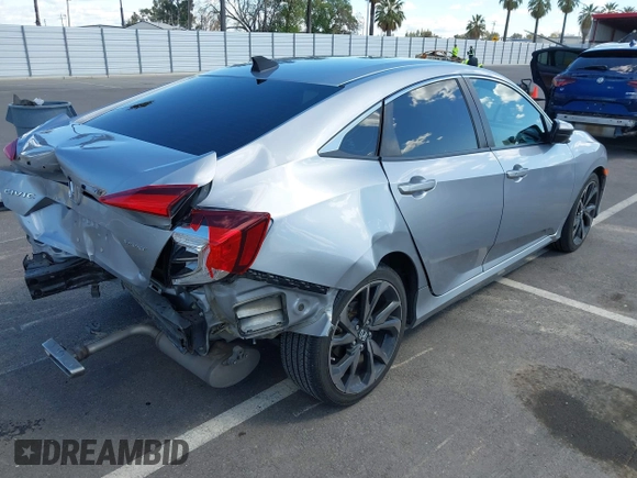 2019 Honda Civic Sedan Sport with VIN 2HGFC2F82KH519464, listed as a IAAI auction lot 41940030 with 59,718 mi miles. Bid and sale history available at carsss.com. Image 4.