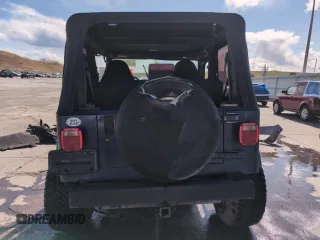 1997 Jeep Wrangler SE z VIN 1J4FY29P1VP441353, wystawiony jako Copart lot #51691545 z przebiegiem Nie podano mil oraz Szkoda całkowita • Salvage title. Historia ofert i sprzedaży dostępna na DreamBid. Obrazek 6.