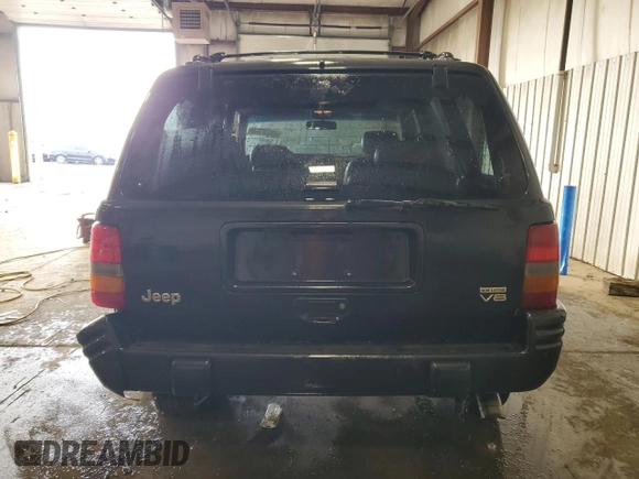 1998 Jeep Grand Cherokee Limited z VIN 1J4GZ88Z0WC276394, wystawiony jako Copart lot #46702355 z przebiegiem 144 232 mil mil oraz Szkoda całkowita • Salvage title. Historia ofert i sprzedaży dostępna na DreamBid. Obrazek 6.