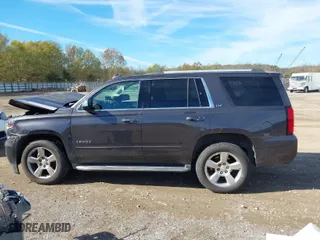 2015 Chevrolet Tahoe LTZ with VIN 1GNSKCKC3FR640615, listed as a IAAI auction lot 40843080 with 142,445 mi miles. Bid and sale history available at carsss.com. Image 14.