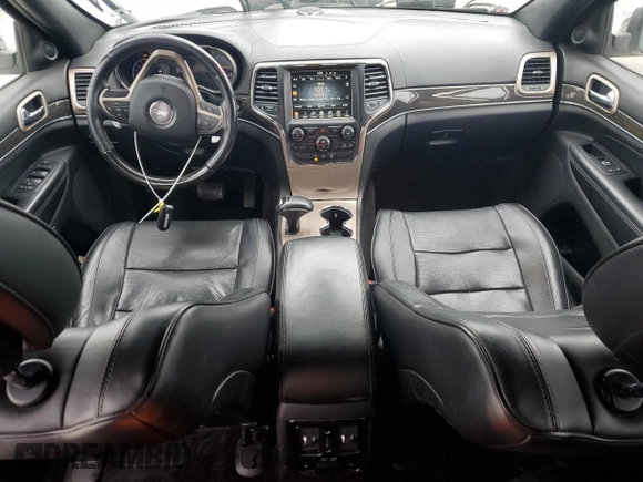 2015 Jeep Grand Cherokee Overland with VIN 1C4RJECG7FC872175, listed as a Copart auction lot 50653205 with 117,433 mi miles and Salvage title. Bid and sale history available at DreamBid. Image 8.