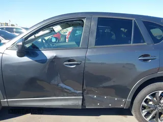 2016 Mazda CX-5 Grand Touring z VIN JM3KE2DYXG0649781, wystawiony jako IAAI lot #41636329 z przebiegiem 83 433 mil mil oraz . Historia ofert i sprzedaży dostępna na DreamBid. Obrazek 14.