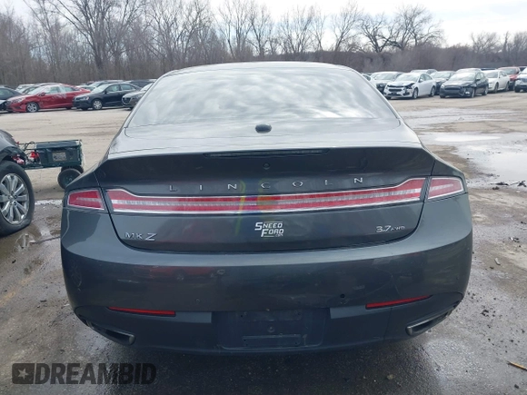 2015 Lincoln MKZ z VIN 3LN6L2JK4FR623686, wystawiony jako IAAI lot #41721095 z przebiegiem 197 922 mil mil oraz . Historia ofert i sprzedaży dostępna na DreamBid. Obrazek 17.