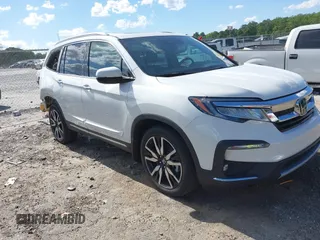 2020 Honda Pilot Touring 7-Passenger z VIN 5FNYF6H65LB062349, wystawiony jako IAAI lot #42331599 z przebiegiem 54 771 mil mil oraz . Historia ofert i sprzedaży dostępna na DreamBid. Obrazek 1.