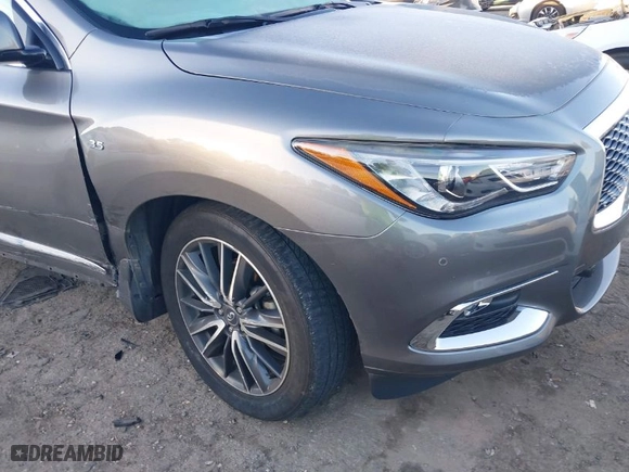 2020 Infiniti QX60 LUXE with VIN 5N1DL0MMXLC506990, listed as a IAAI auction lot 41307122 with 83,657 mi miles. Bid and sale history available at carsss.com. Image 6.
