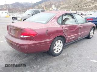 2004 Ford Taurus SE with VIN 1FAFP53214G150248, listed as a IAAI auction lot 41543177 with 99,553 mi miles and . Bid and sale history available at DreamBid. Image 4.