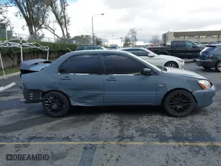 2004 Mitsubishi Lancer ES with VIN JA3AJ26E54U054570, listed as a IAAI auction lot 41592397 with 220,140 mi miles. Bid and sale history available at carsss.com. Image 13.
