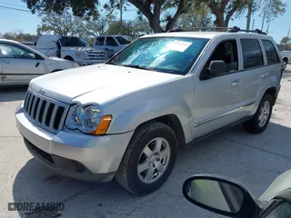 2010 Jeep Grand Cherokee Laredo with VIN 1J4PS4GK3AC163307, listed as a IAAI auction lot 41681527 with 155,464 mi miles. Bid and sale history available at carsss.com. Image 2.